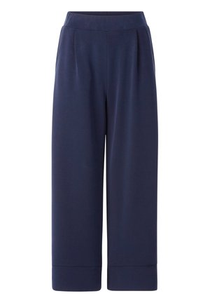 Pantalons bleu marine à jambes larges en tissu doux ; dotés d'une taille haute et de plis subtils, avec des ourlets de cheville retroussés.