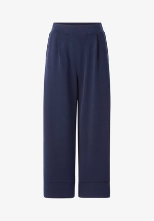 Navy blue wide-leg pants made of soft fabric; feature a high waistband and subtle pleats, with cuffed ankle hems.