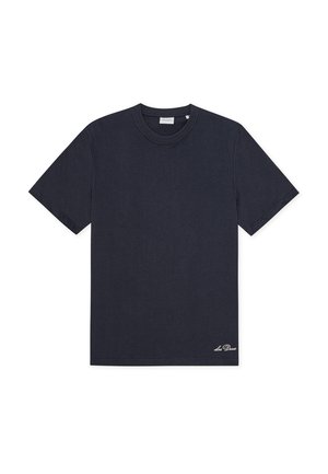 T-shirt a maniche corte in cotone di colore blu navy scuro. Scollo rotondo, orlo dritto e piccolo logo del marchio bianco ricamato in basso a sinistra.
