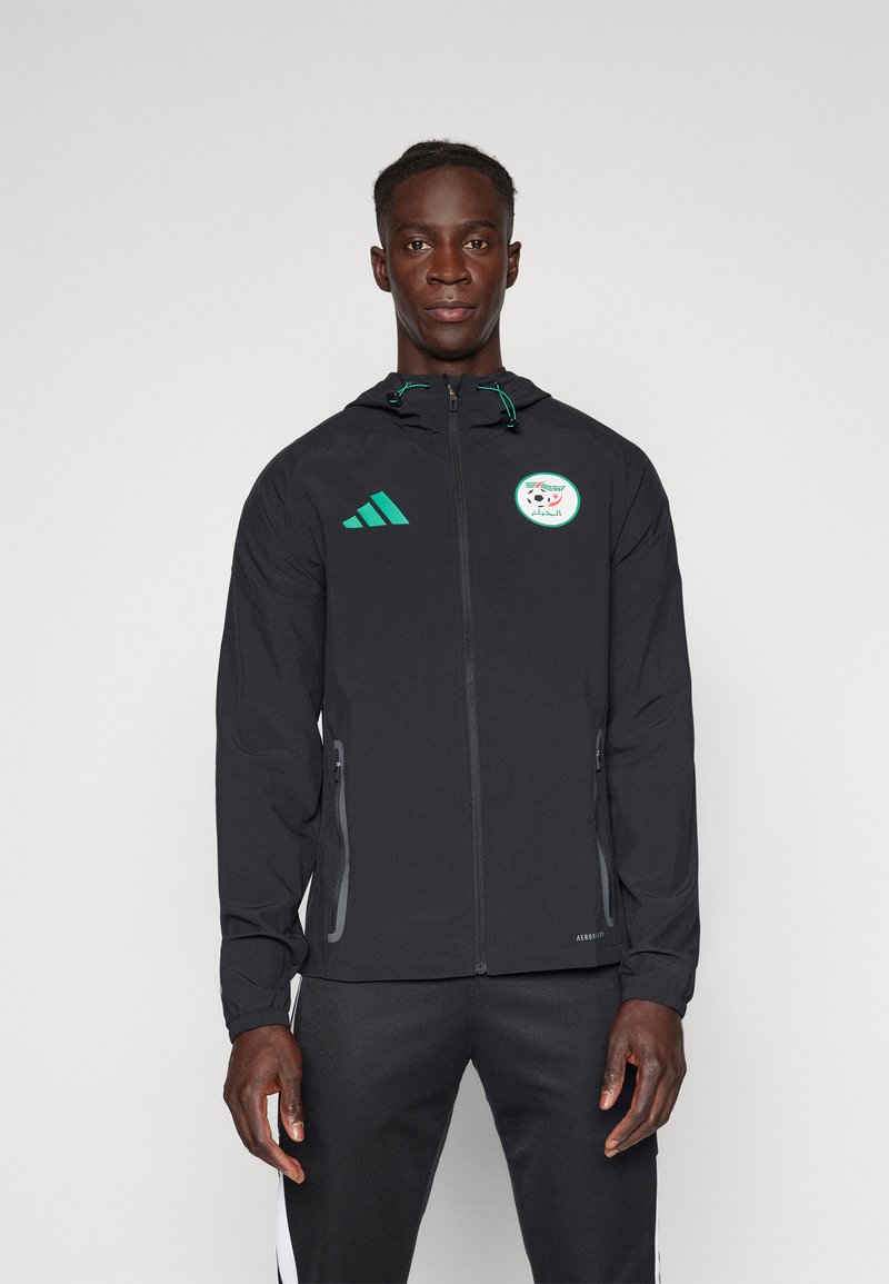 Black lightweight jacket with a hood, green accents, and an Algeria soccer logo on the chest. Features zippered side pockets.