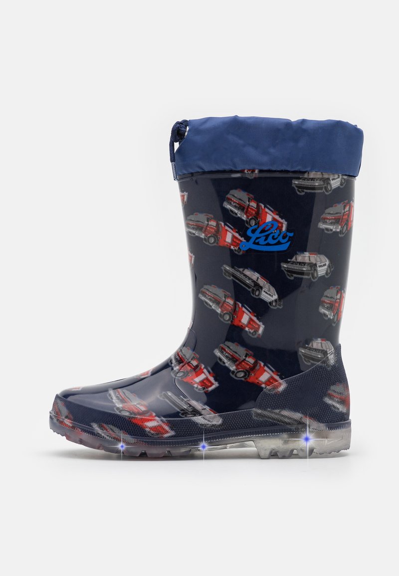 Blue and navy rubber rain boot with fire truck and police car patterns, featuring a contrasting blue cuff and light-up sole accents.