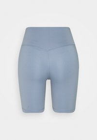 Modré cyklistické šortky s vysokým pasem z elastické látky, s hladkými švy a přiléhavým střihem.