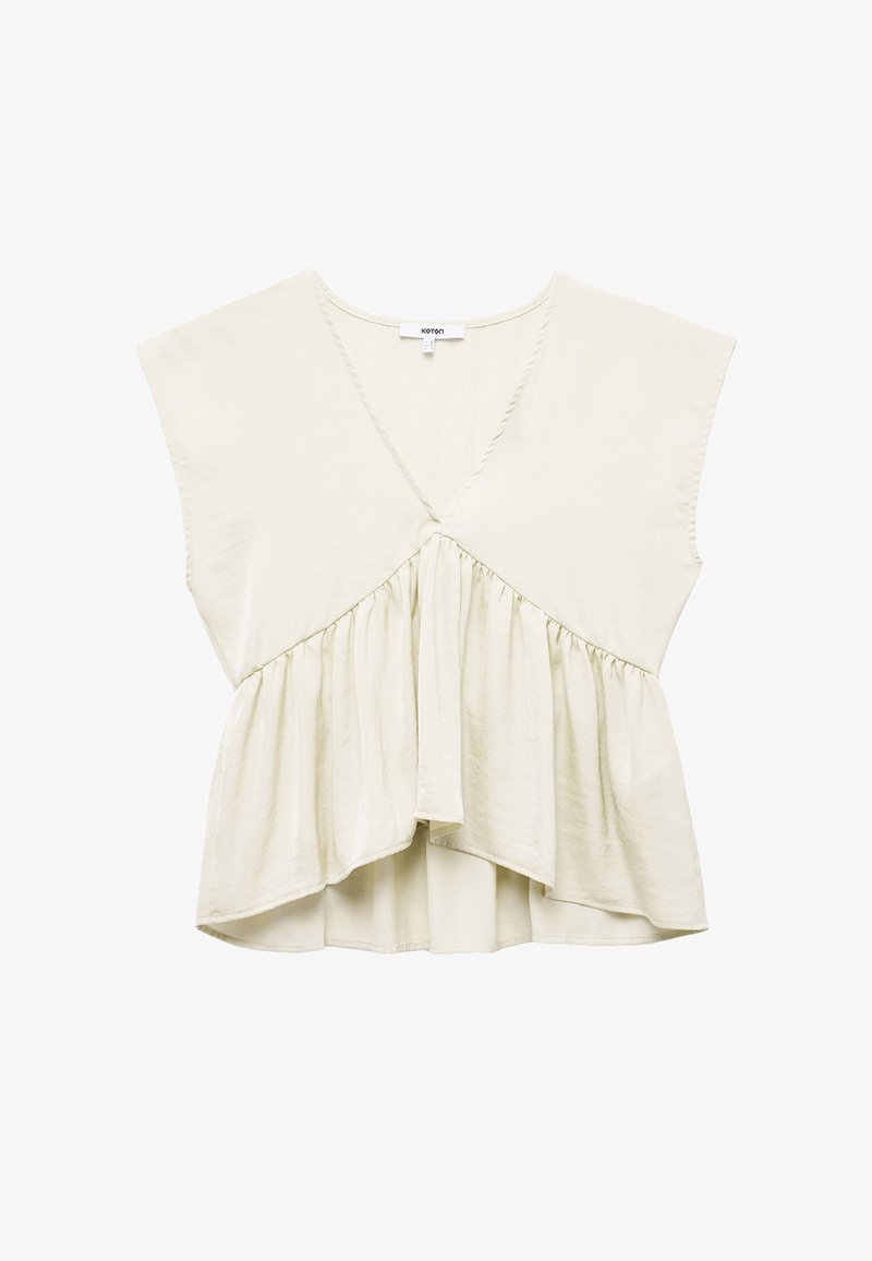 Lys beige top med dyb V-hals, korte batwing ærmer og en sammensamlet talje, med et svævende, lagdelt design og blød tekstur.