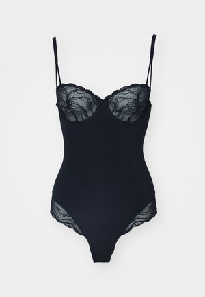 Black bodysuit with lace detailing at the neckline and edges, thin adjustable straps, and a fitted shape. Smooth fabric with a subtle sheen.