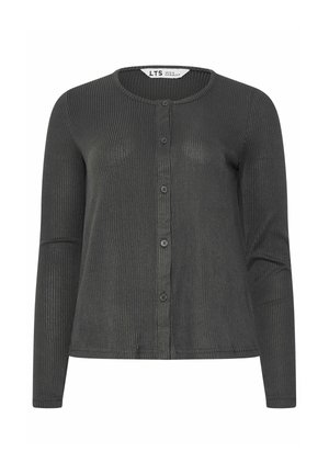 Vrouw met blond haar die een donkergrijs geribd shirt met lange mouwen en bijpassende geribde broek draagt, van achteren gezien tegen een effen achtergrond.