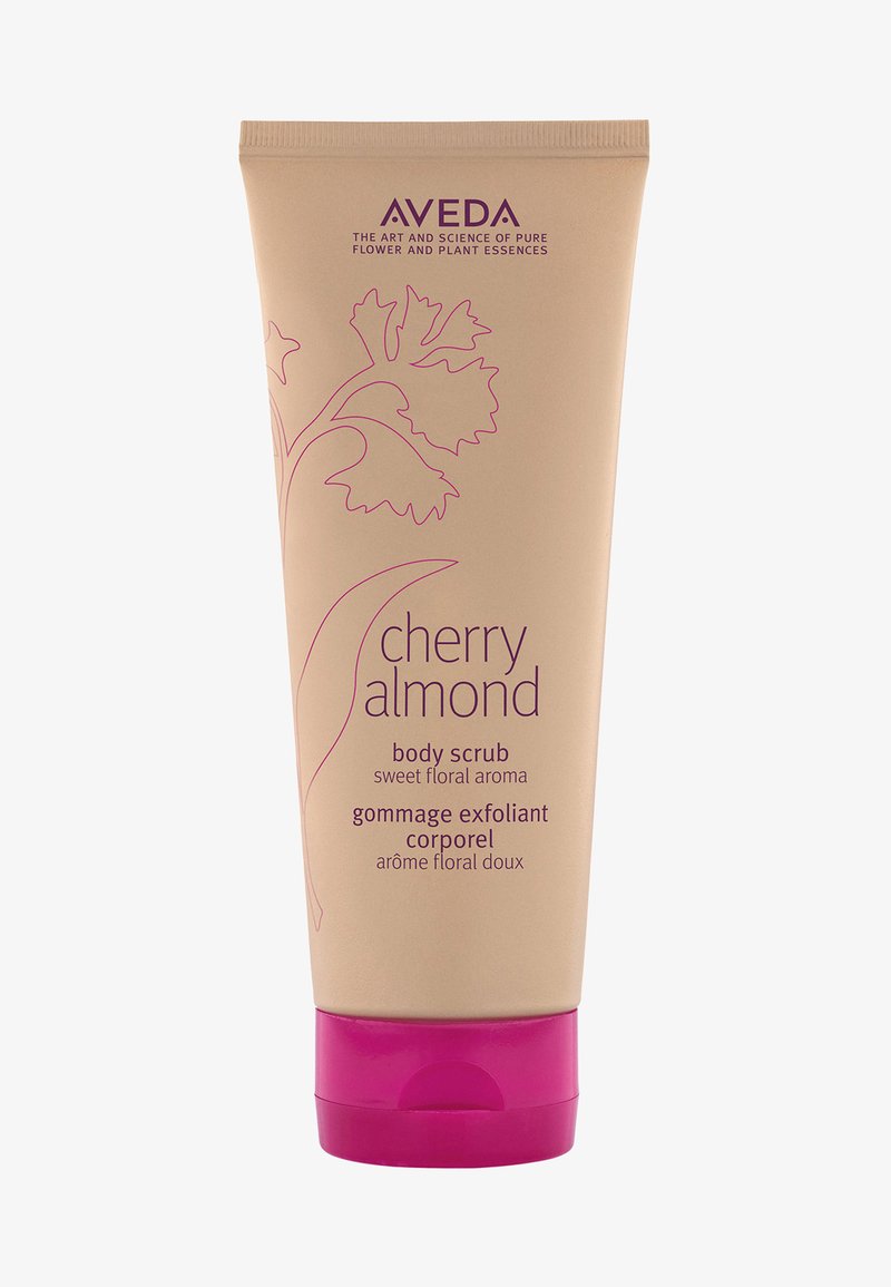 Aveda Cherry Almond Körperpeeling in einer beigen Tube mit pinkem Deckel. Enthält Text in Lila und florale Designelemente.