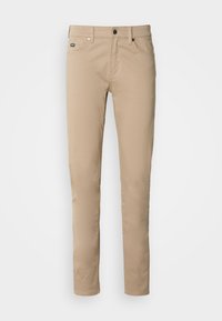 Beige katoenen twill broek met een slim fit, voorzien van vijf zakken, een knoopsluiting en subtiele stikdetails.