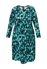 Šaty v tehlovej a čiernej farbe s kruhovým vzorom, s dlhými rukávmi a okrúhlym výstrihom, vyrobené z jemného materiálu s voľným strihom.