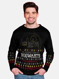 Schwarzer Weihnachts-Pullover mit grafischem Design, das Hogwarts zeigt, Text: "ICH WÜRDE LIEBER AN HEILIGABEND IN HOGWARTS BLEIBEN" und bunten Akzenten.