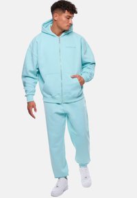 Dropsize LOOSE FIT  - Pantalones deportivos - turquoise