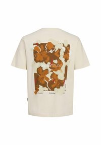 Cream cotton t-shirt featuring a large, abstract floral print in brown, cream, and red on the back. Short sleeves and a crew neckline.