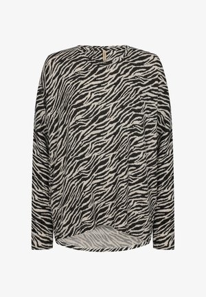 Long-sleeve top in a soft fabric, featuring a black and cream zebra stripe pattern; round neckline and a slightly curved hem.