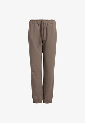 Barna melegítőnadrág rugalmas derékkal és állítható zsinórral. Szükség szerint szűkített szárakkal és oldalsó zsebekkel rendelkezik. Puha anyagból készült.