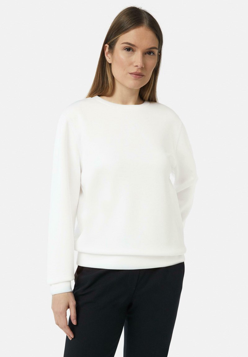 Witte sweatshirt met een ronde halslijn en lange mouwen, gemaakt van zachte stof. Beschikt over ribgebreide manchetten en zoom, minimalistisch ontwerp.