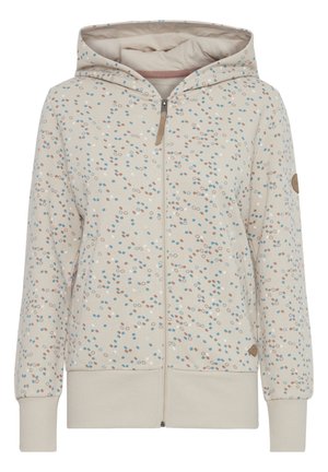 Lys beige hettejakke med glidelås, med et flerfarget prikkemønster i blått, brunt og hvitt. Ribbede mansjetter og nederkant.