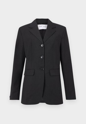 Svart blazer laget av teksturert stoff med en skreddersydd passform, enkeltradsdesign, klaffeslag og tre frontknapper. Har to frontlommer.