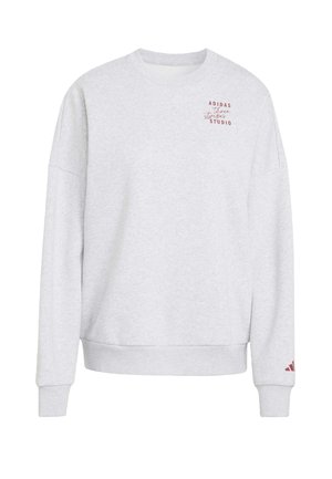 Light gray long-sleeve Adidas sweatshirt with small red "Adidas three stripes studio" text on chest and logo on left sleeve cuff.