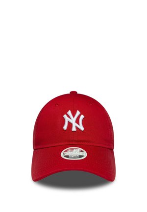 Red baseball cap with a white embroidered "NY" logo centered on the front and a curved brim with an adjustable fit sticker.