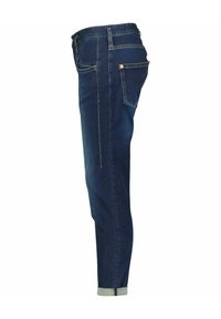 Dark blue jeans with a slim fit, featuring a cuffed hem, five-pocket design, and contrasting yellow stitching.