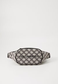 Fanny pack in textured fabric featuring a black and white houndstooth pattern. Zipper closure with a logo on the front in black lettering.