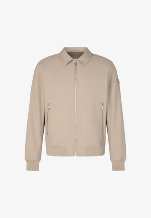Beige Bomberjacke mit Reißverschluss vorne, zwei Seitentaschen, gerippten Bündchen und Saum sowie einem glatten, leichten Stoff. Mit einem Logo-Akzent.