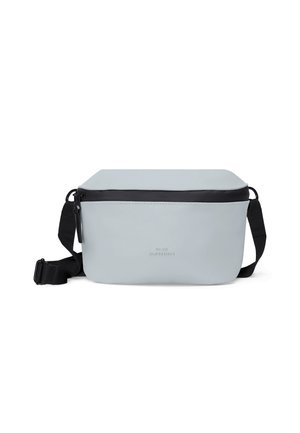Light gray rectangular crossbody bag with black zipper and adjustable black strap, featuring subtle front logo detailing.
