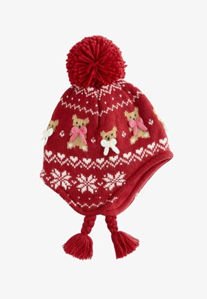 Red knitted hat with a large pompom, featuring bear designs with pink bows, white snowflakes, and braided tassels at the sides.