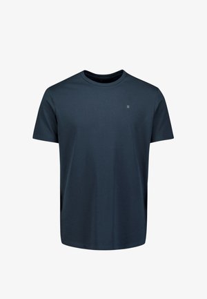 Katoenen t-shirt met ronde hals in donker marineblauw. Korte mouwen, normale pasvorm. Klein accentlogo op de borst. Glad textuur. Geen patronen.