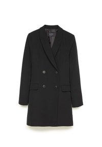 Black double-breasted blazer with notched lapels, two front pockets, and large black buttons. Smooth fabric and a tailored silhouette.