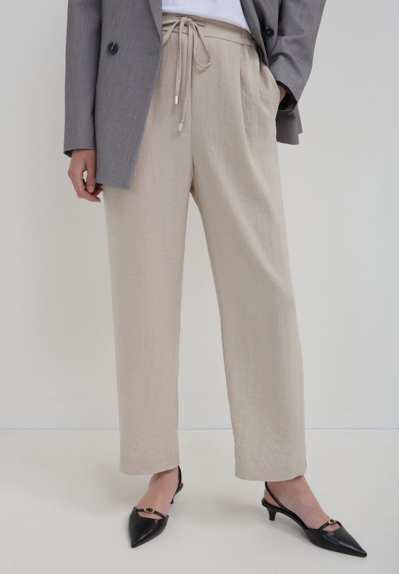 Calliope JOGGER  - Pantalon de survêtement - beige