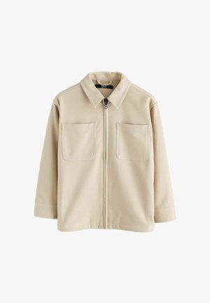 Beige jakke med lynlås, to brystlommer, lange ærmer og krave, lavet af struktureret stof.