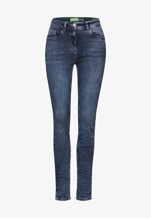 Dunkelblaue Skinny Jeans aus glattem Denim mit fünf Taschen, Reißverschlussfliege und kontrastierendem grünen Etikett am Bund.
