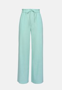Pantalones de pierna ancha en verde claro, confeccionados con un tejido suave y texturizado, que cuentan con una cinturilla elástica y un cordón para ajustar.