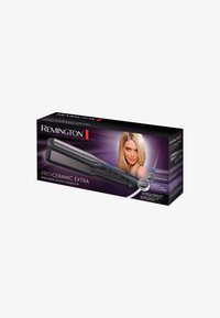 Boîte du lisseur Remington Pro-Ceramic Extra avec lisseur noir et une femme blonde aux cheveux lisses sur fond violet.