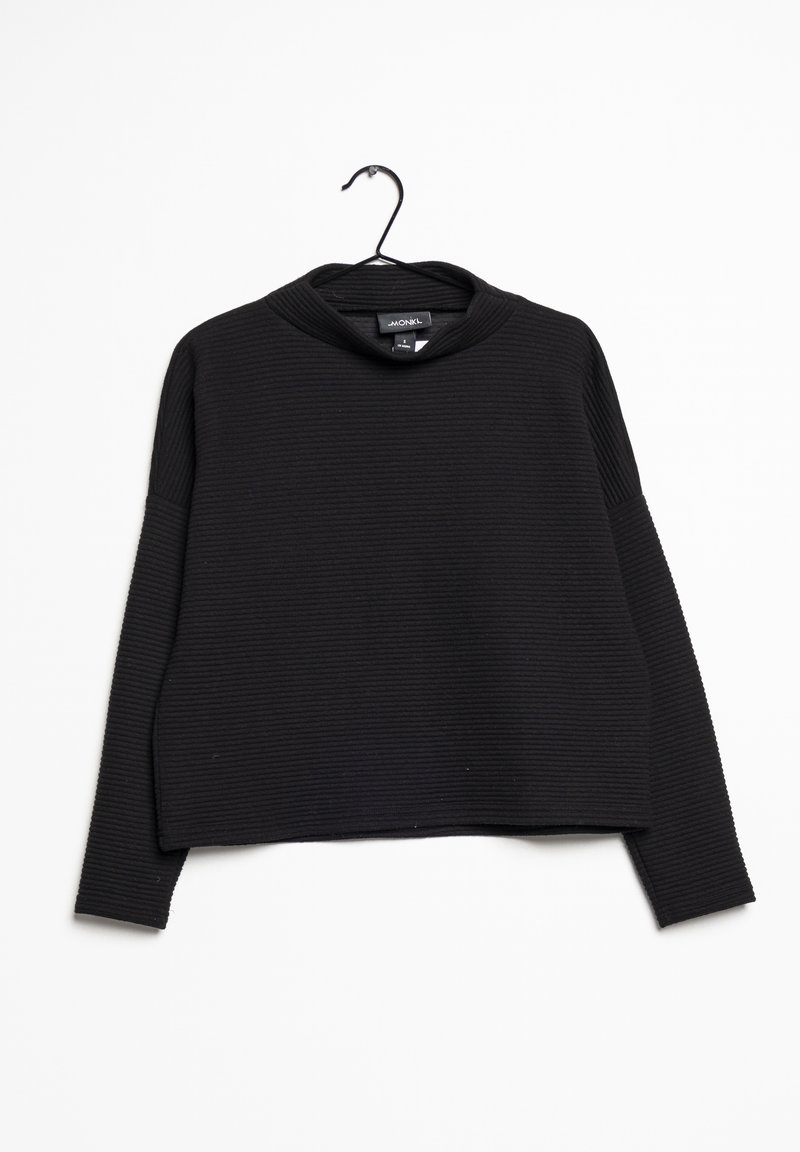 Mustaa lyhythihaista neulepuseroa, jossa on ribbitekstuuri, korkea kaulus ja pitkät hihat. Roikkuu mustassa koukussa valkoista taustaa vasten.