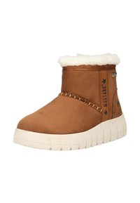 Brun ankelstøvle med hvid pelsforing, tyk hvid sål, syningsdetalje foran og "Mustang"-branding på siden.