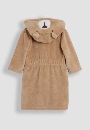 Peščena flis kopalna halja z kapuco v obliki medveda, ki ima okrogla ušesa in podrobnosti obraza. Opremljena je z pasom in dolgimi rokavi, mehka na dotik.