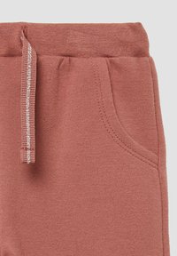Roze sweatshirtbroeken van een zachte stof, met een geribde tailleband, verstelbaar trekkoord en details van zijzakken.