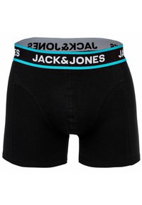 Svarta boxershorts med en bred elastisk midjeband som har texten "JACK&JONES" i vitt mot en grå bakgrund med blå accent.