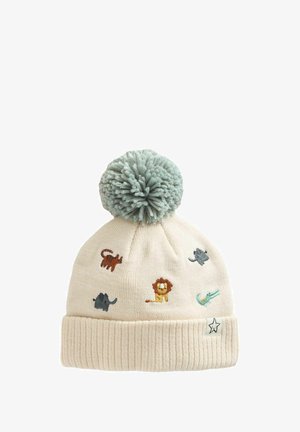 Bonnet en tricot crème avec un grand pompon gris et de petits animaux brodés : tigre, lion, éléphant, souris et crocodile.