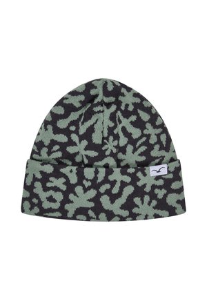 Black and green knit beanie with abstract floral pattern and small white tag featuring a bird logo on the cuff.