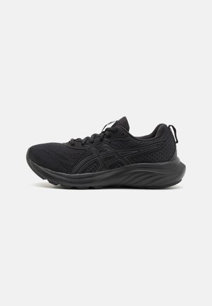 Black athletic shoes with a breathable mesh upper, structured sole, round toe, and a textured surface. Features black laces and logo details.
