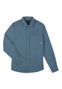 Langemouwige shirt van zacht teal stof, met een knoopsluiting aan de voorkant, een enkele borstzak en een ronde onderkant. De knopen zijn bruin.