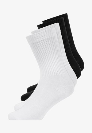 Cotton socks set in black and white, featuring ribbed texture, crew length, and reinforced toe and heel for durability.