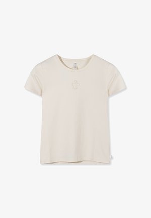 Camiseta lisa de manga corta beige con cuello redondo y pequeño logo en relieve centrado debajo del cuello.