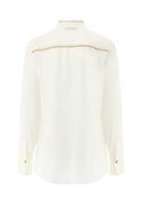 White long-sleeve shirt with a straight cut, featuring a contrasting gold stitch along the back yoke and button cuffs. Smooth fabric.