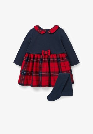 Robe à manches longues bleu marine avec jupe à carreaux rouges, col et nœud assortis en tissu à carreaux, accompagnée de collants bleu marine.