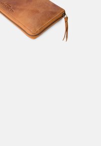 Brown leather zippered wallet with embossed branding and two leather pulls on the zipper against a white background.