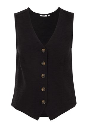 Gilet senza maniche nero con scollo a V, tessuto texturizzato e cinque grandi bottoni marroni lungo la parte anteriore, con un taglio sartoriale e orlo asimmetrico.