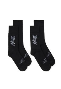 Calze nere in cotone con polsini a costine, caratterizzate da testo del logo bianco sui lati e sulla suola. Design classico con una texture liscia.